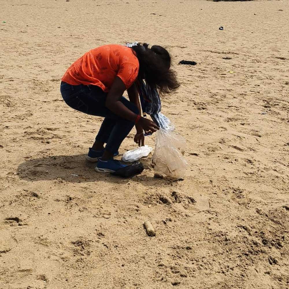 Volunteers collecting plastic waste at Chennai beach - Timeless Foundation