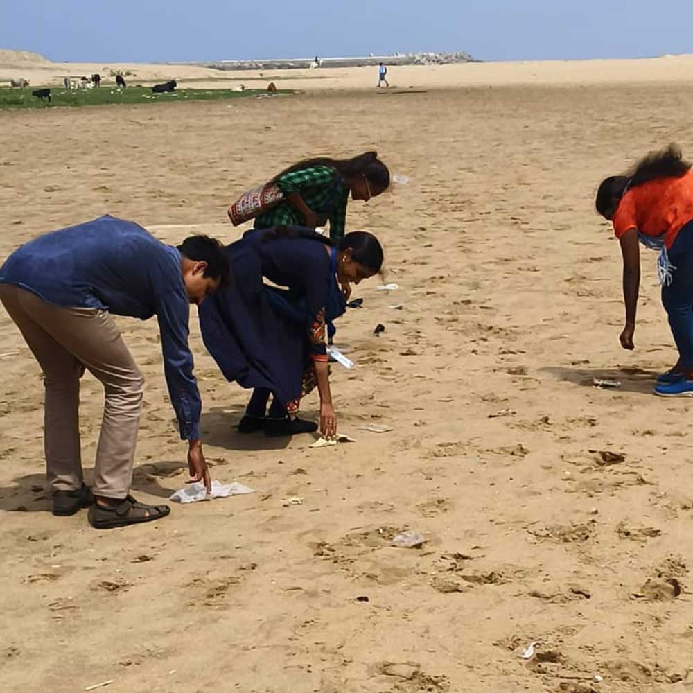 Beach cleanup drive team work - Timeless Foundation